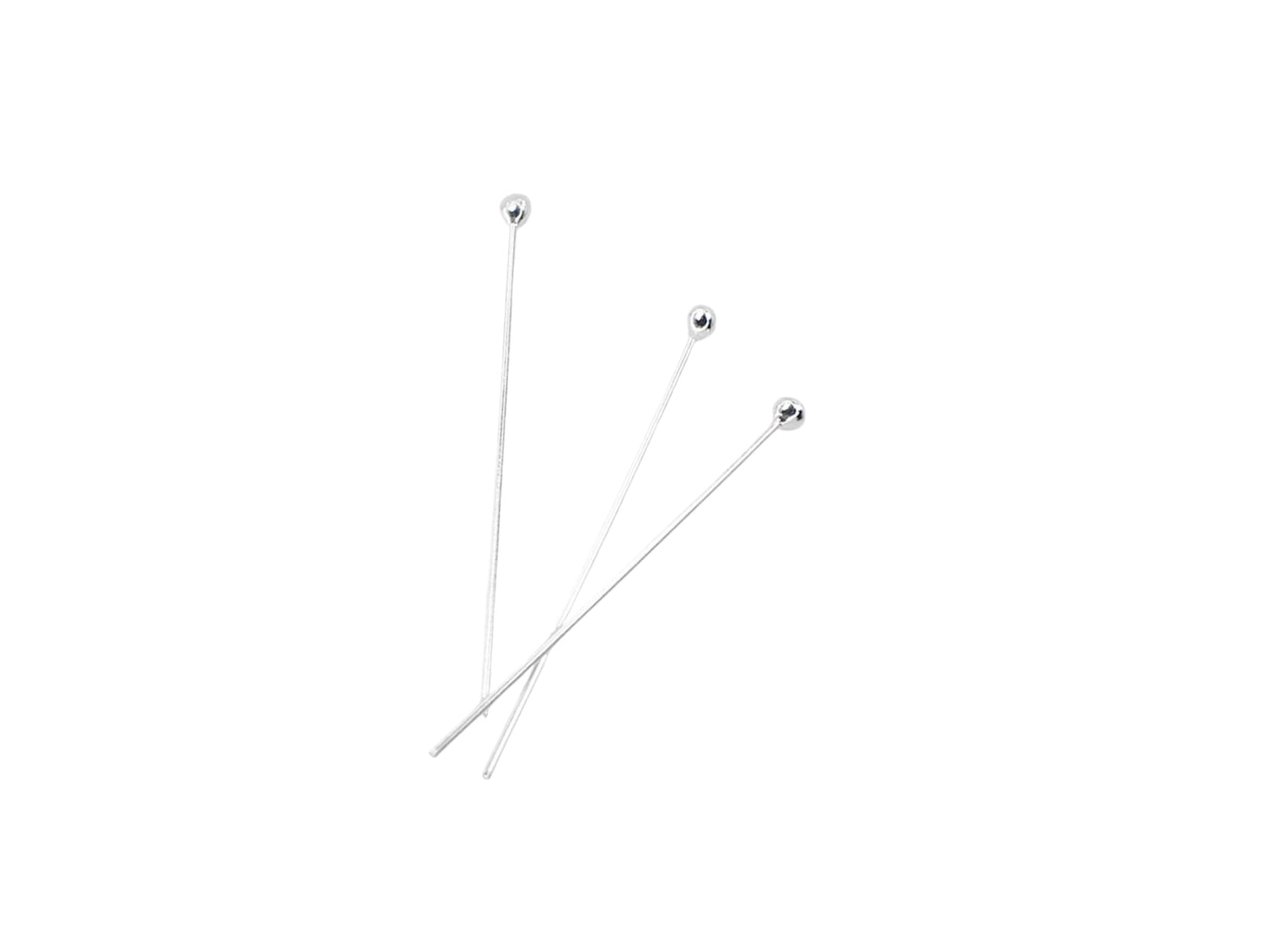 Three silver ball headpins on a white background