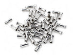 Silver plated alloy bamboo shaped spacer beads on a white surface