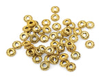 gold plated daisy rondelle spacer beads on a white background