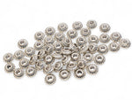 tibetan silver ribbed rondelle beads on a white background