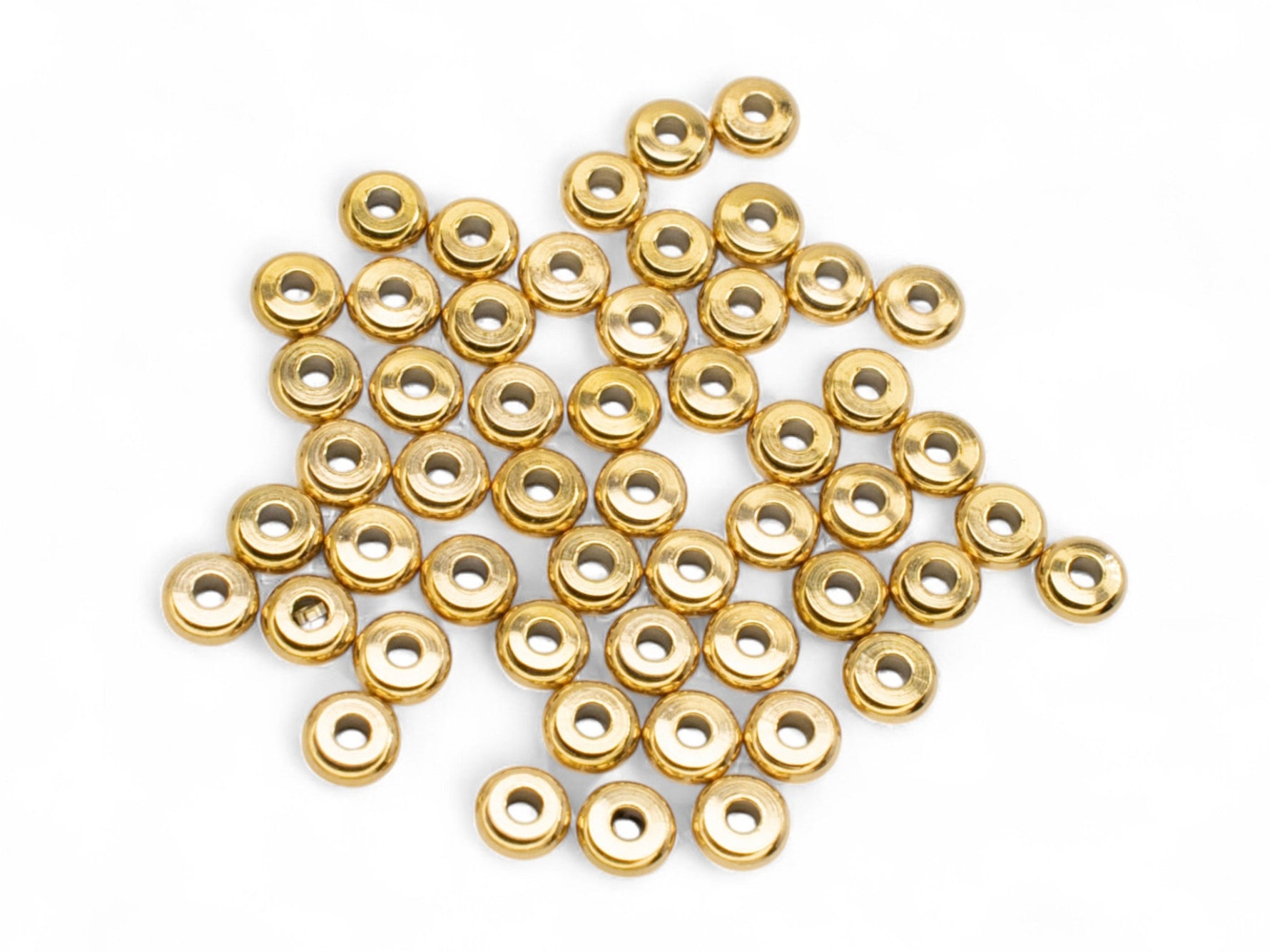 Rondelle Abacus Gold Plated Stainless Steel beads 4mm on a white surface