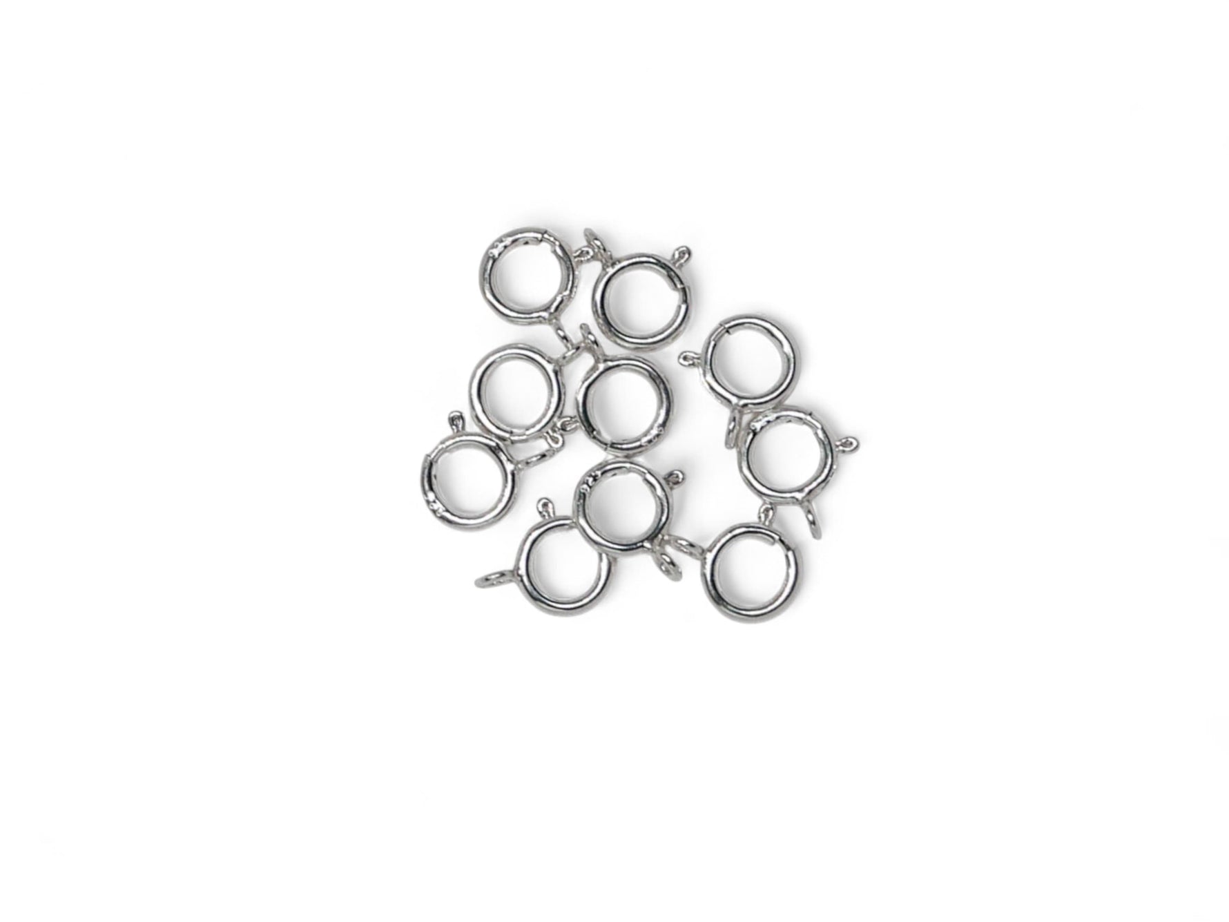 Silver spring ring jewelry clasps on a white background
