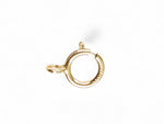 Gold open spring ring clasp on a white background